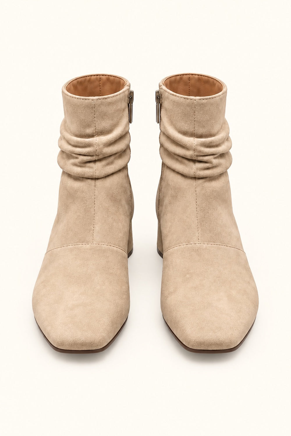 Front view of Corkys Addicted sand faux suede ankle boots featuring square toes, ruched ankle detailing, and neutral tan finish.