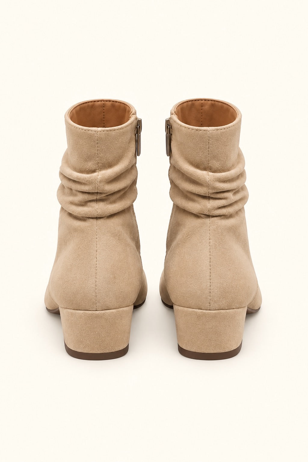 Rear view of Corkys Addicted sand faux suede ankle boots showing ruched shafts, center back seams, side zippers, and low block heels.