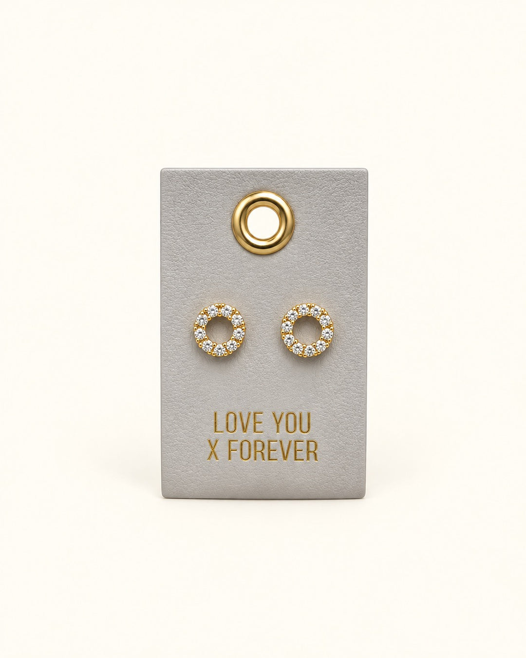 Gold-tone open circle stud earrings with sparkling clear crystal accents displayed on a grey Love You X Forever wedding leather gift tag.