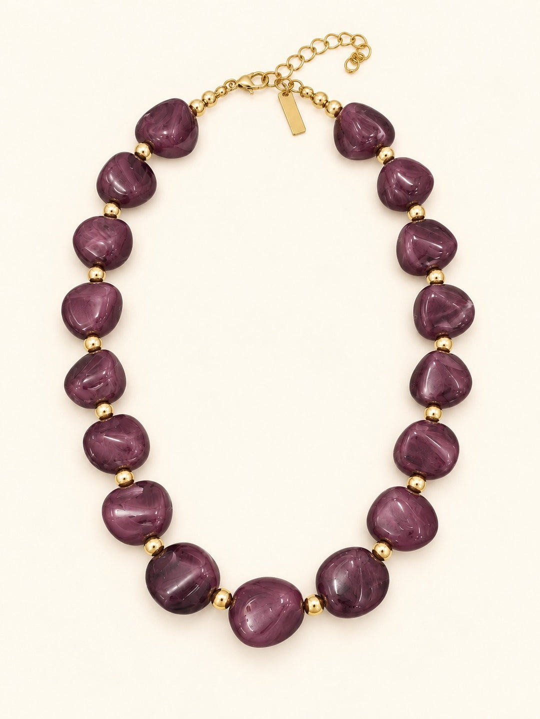 Lindon Plum Beaded Statement Necklace with rich purple-pink resin beads, gold-tone accents, and adjustable lobster clasp closure.