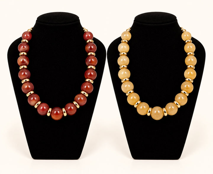 Sellah Beaded Statement Necklaces by Michelle McDowell in Olive and Brown featuring chunky round resin beads with polished gold-tone spacers on black velvet displays.