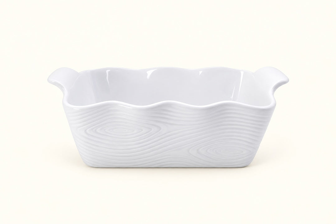 Temp-tations white Woodland stoneware loaf pan featuring embossed woodgrain texture, scalloped rim, glossy finish, deep rectangular shape, and built-in side handles