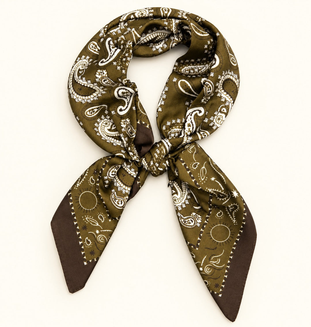 Olive paisley border scarf tied in a neck scarf style with white and brown paisley detailing on a cream background.