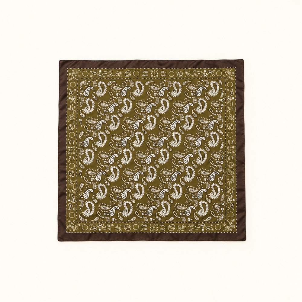 Olive paisley border scarf fully opened in a square flat lay, featuring white paisley print and dark brown trim on a cream background.