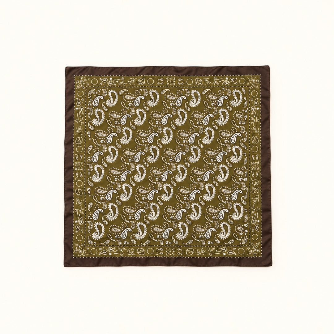 Olive paisley border scarf fully opened in a square flat lay, featuring white paisley print and dark brown trim on a cream background.
