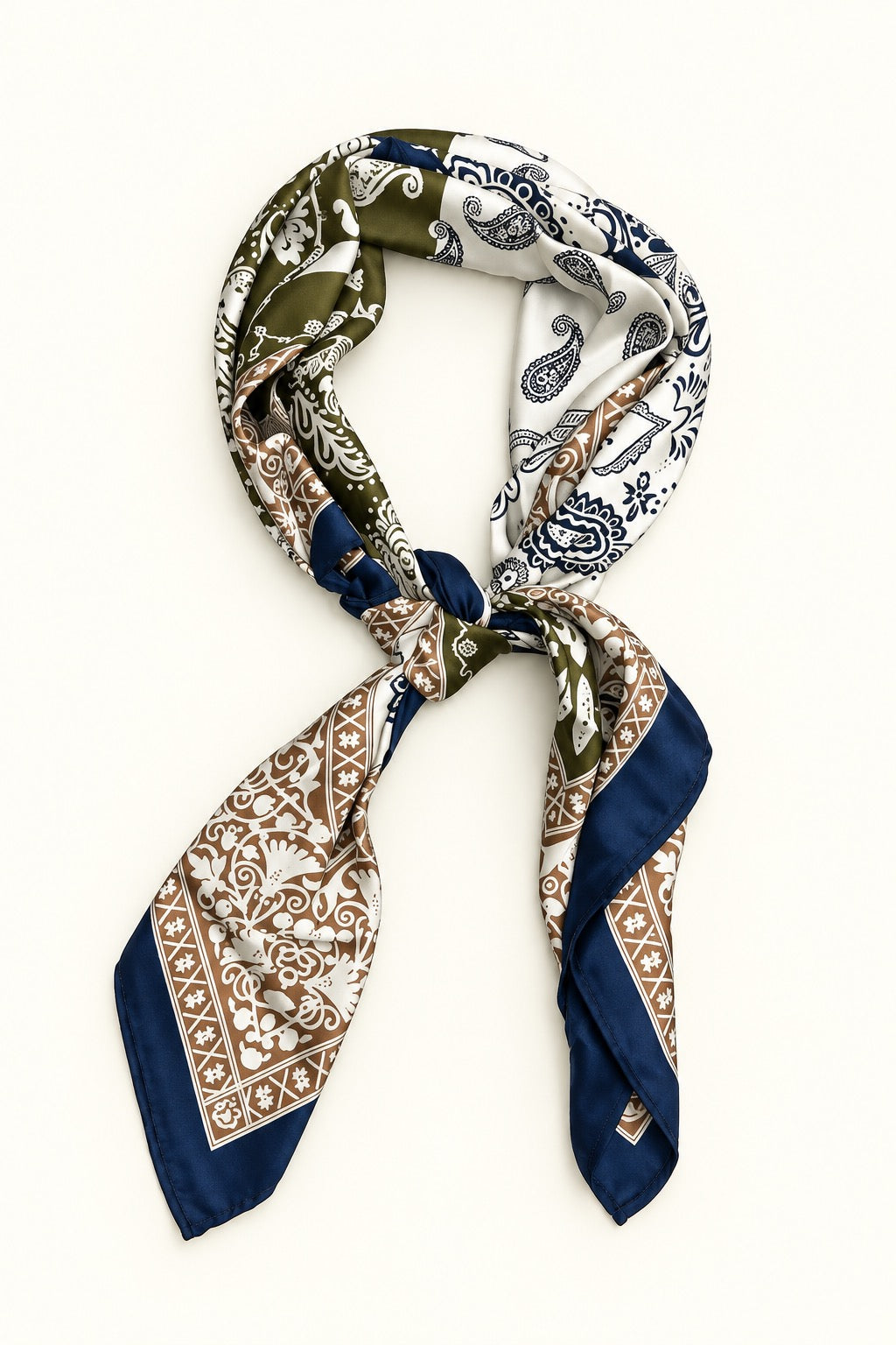 Navy, olive green, cream and tan paisley border scarf tied in a neck scarf style on a cream background.