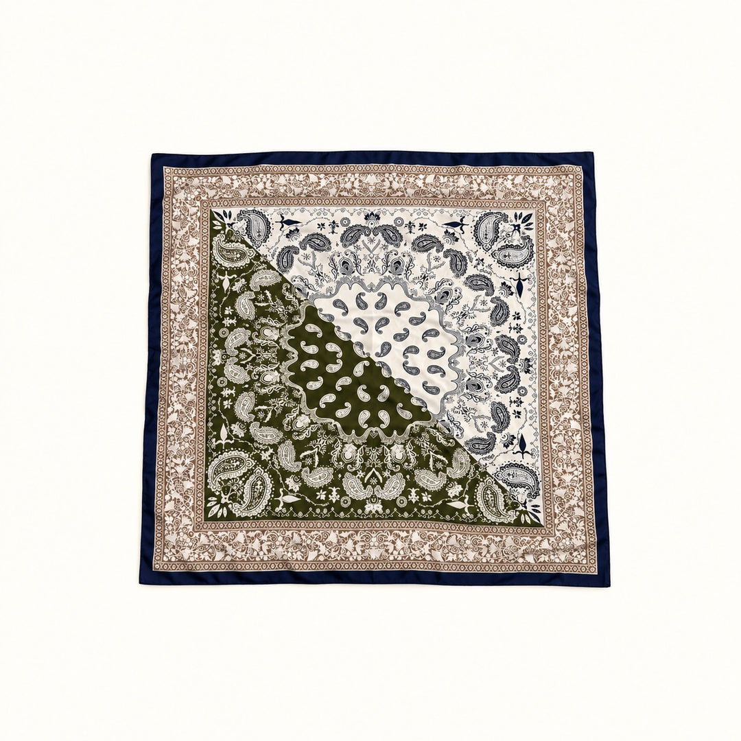 Olive green, cream, tan and navy paisley border scarf displayed open in a square flat lay on a cream background.
