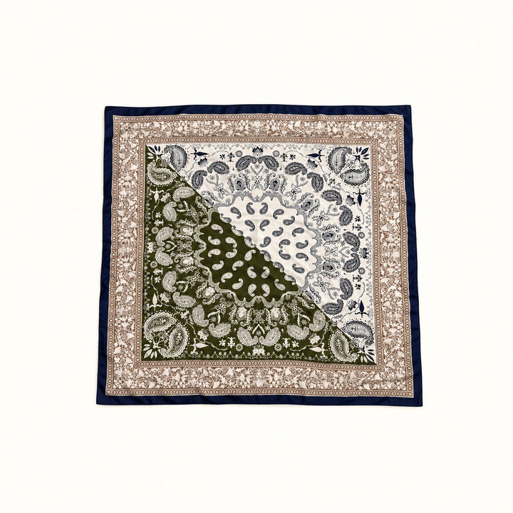 Olive green, cream, tan and navy paisley border scarf displayed open in a square flat lay on a cream background.