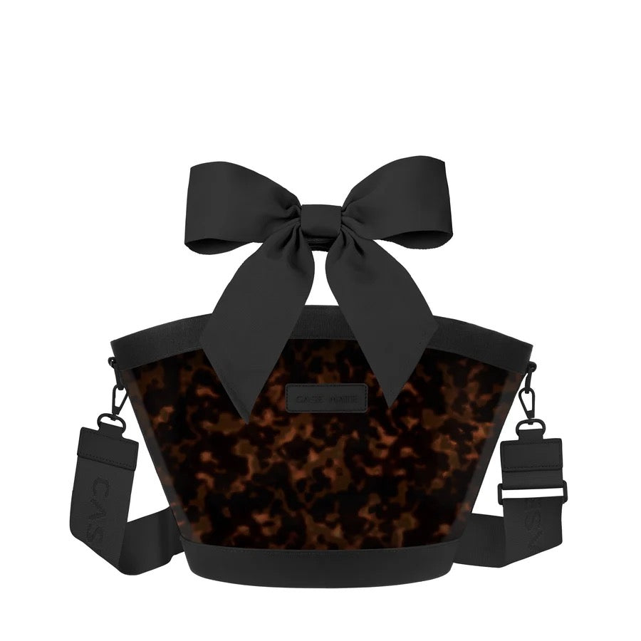Case-Mate Tortoiseshell Bow Cooler Bag featuring a tortoiseshell body, oversized black bow, black trim, and adjustable removable shoulder strap