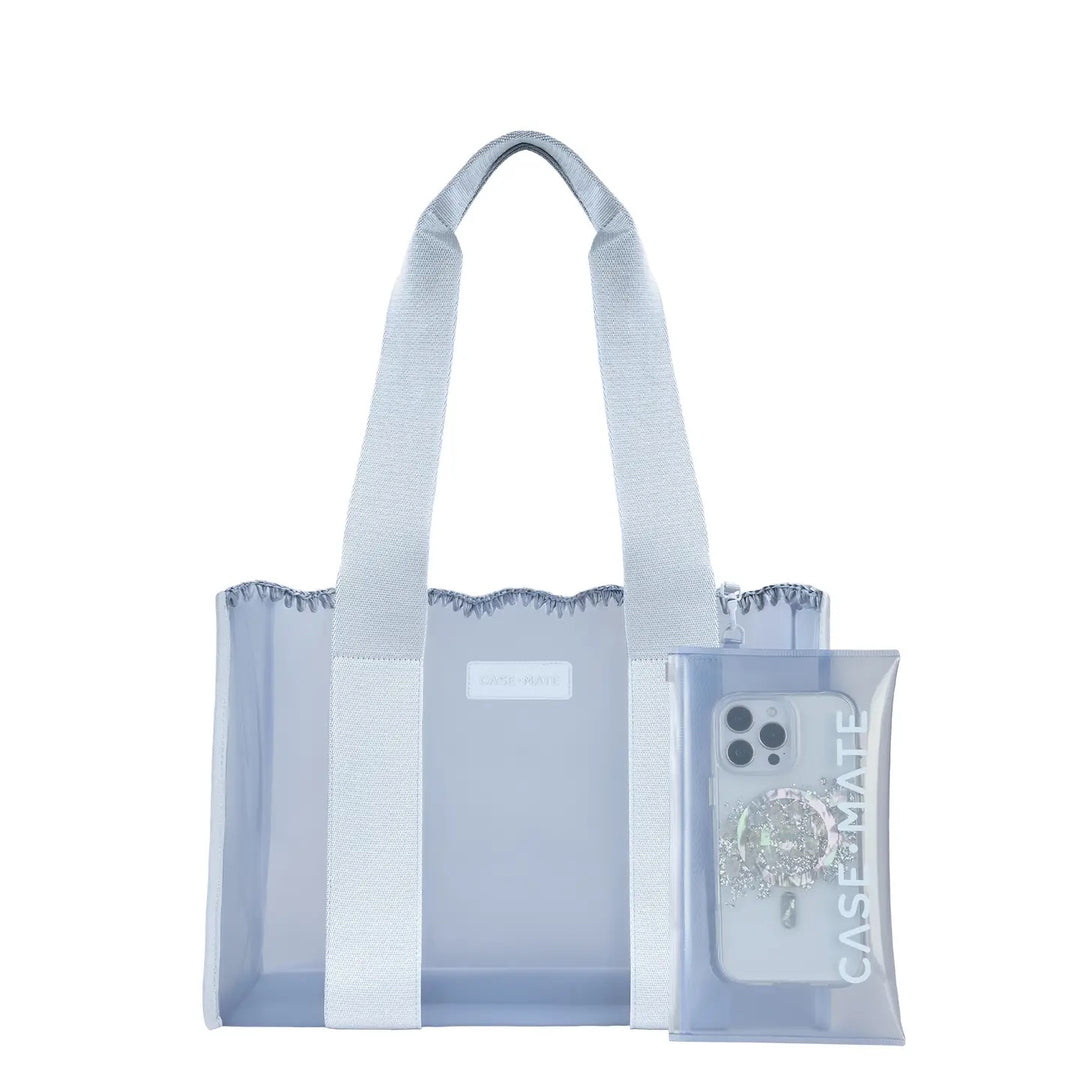 Case-Mate Carolina Blue Crochet Wave Jelly Tote Bag in medium featuring a translucent light blue waterproof TPU body, matching woven shoulder straps, hand-crocheted wavy trim, and front Case-Mate logo. A coordinating transparent blue zip pouch hangs from the handle. Displayed against a clean white studio background.
