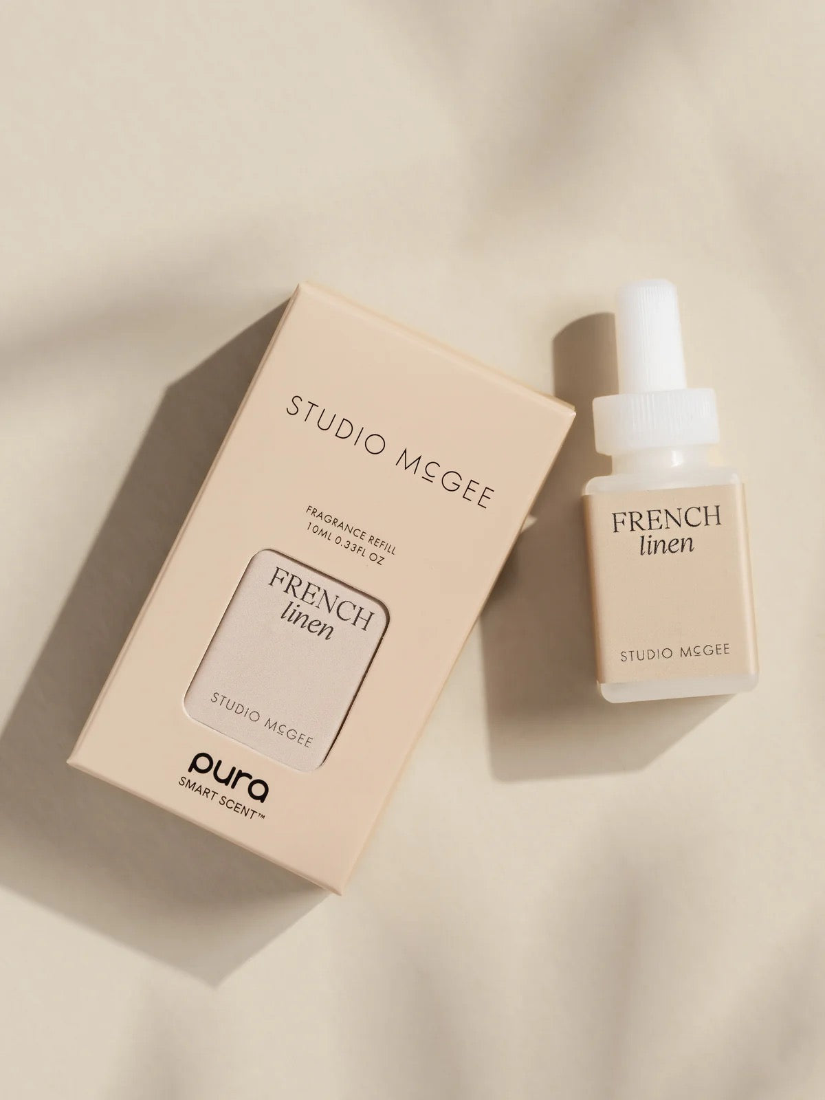 Studio McGee French Linen Pura home fragrance refill bottle and packaging
