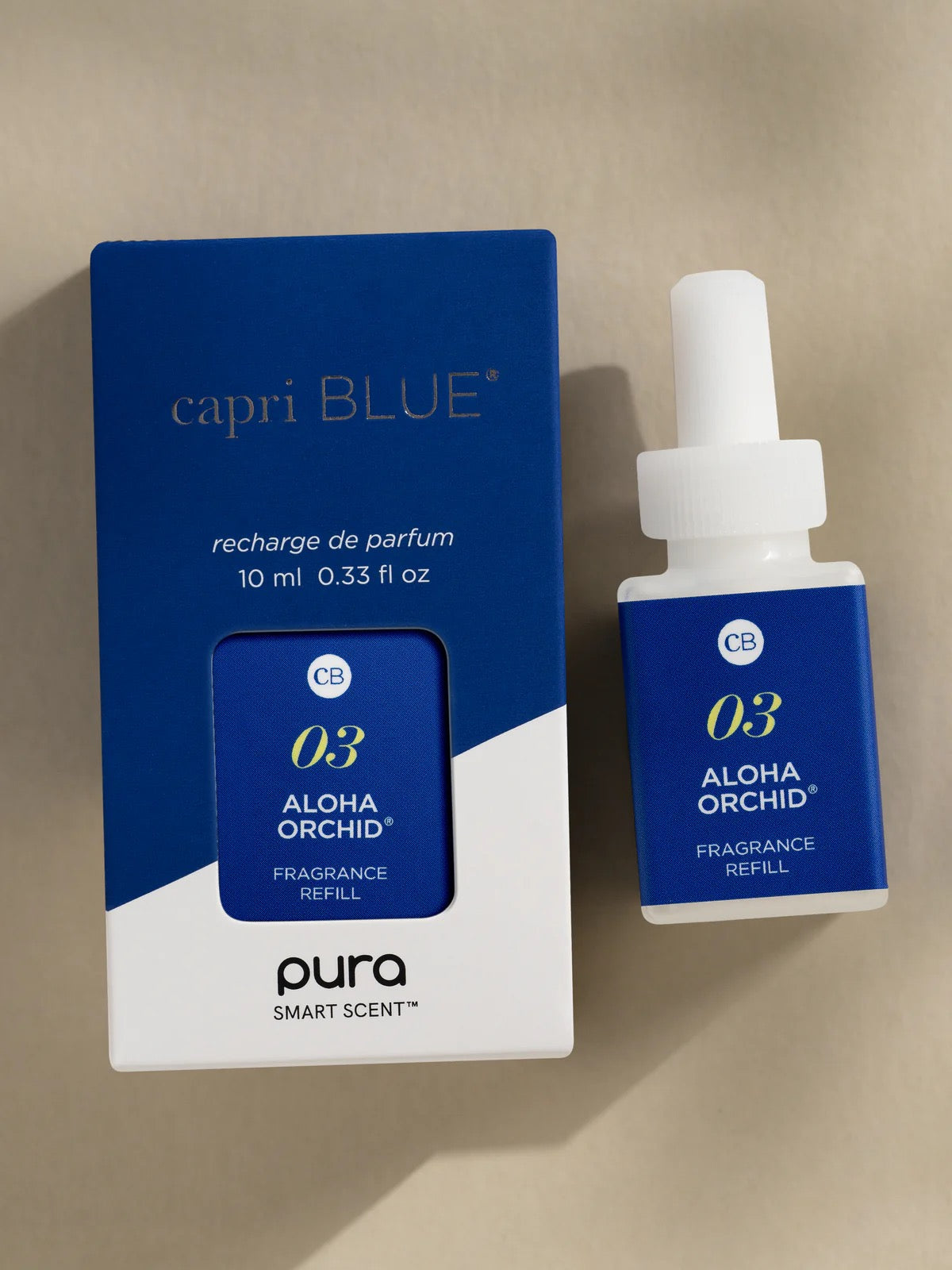 Capri Blue Aloha Orchid fragrance refill on a beige background