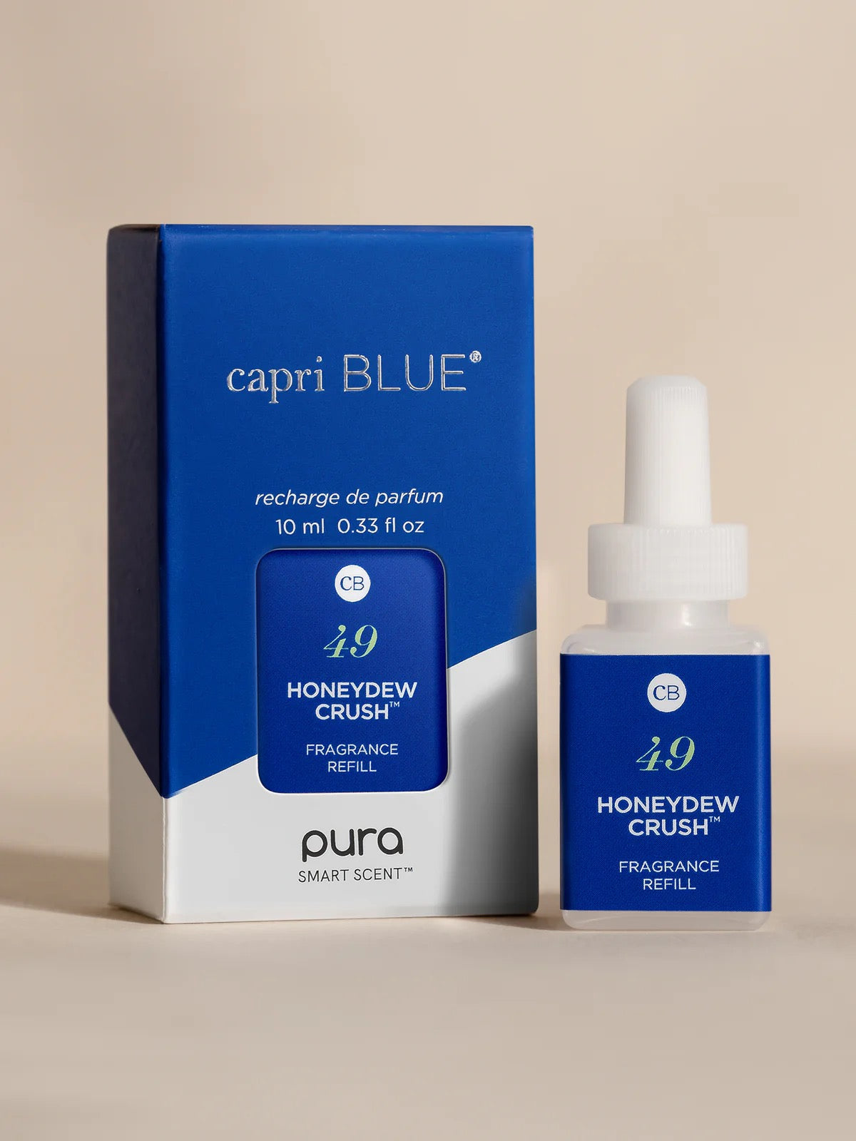 capri BLUE Honeydew Crush fragrance refill packaging and bottle on a beige background