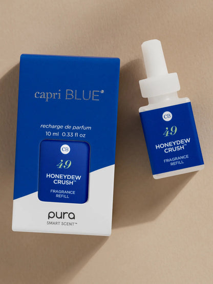 capri BLUE Honeydew Crush fragrance refill on a beige background