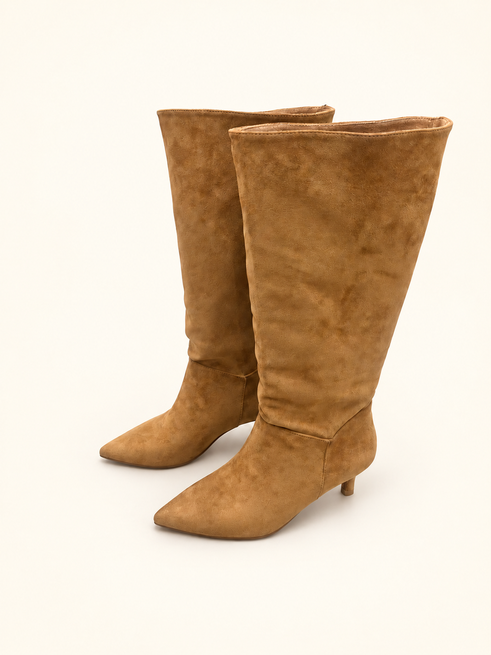 Angled view of Corkys Company Party camel faux-suede boots with pointed toes and kitten heels.