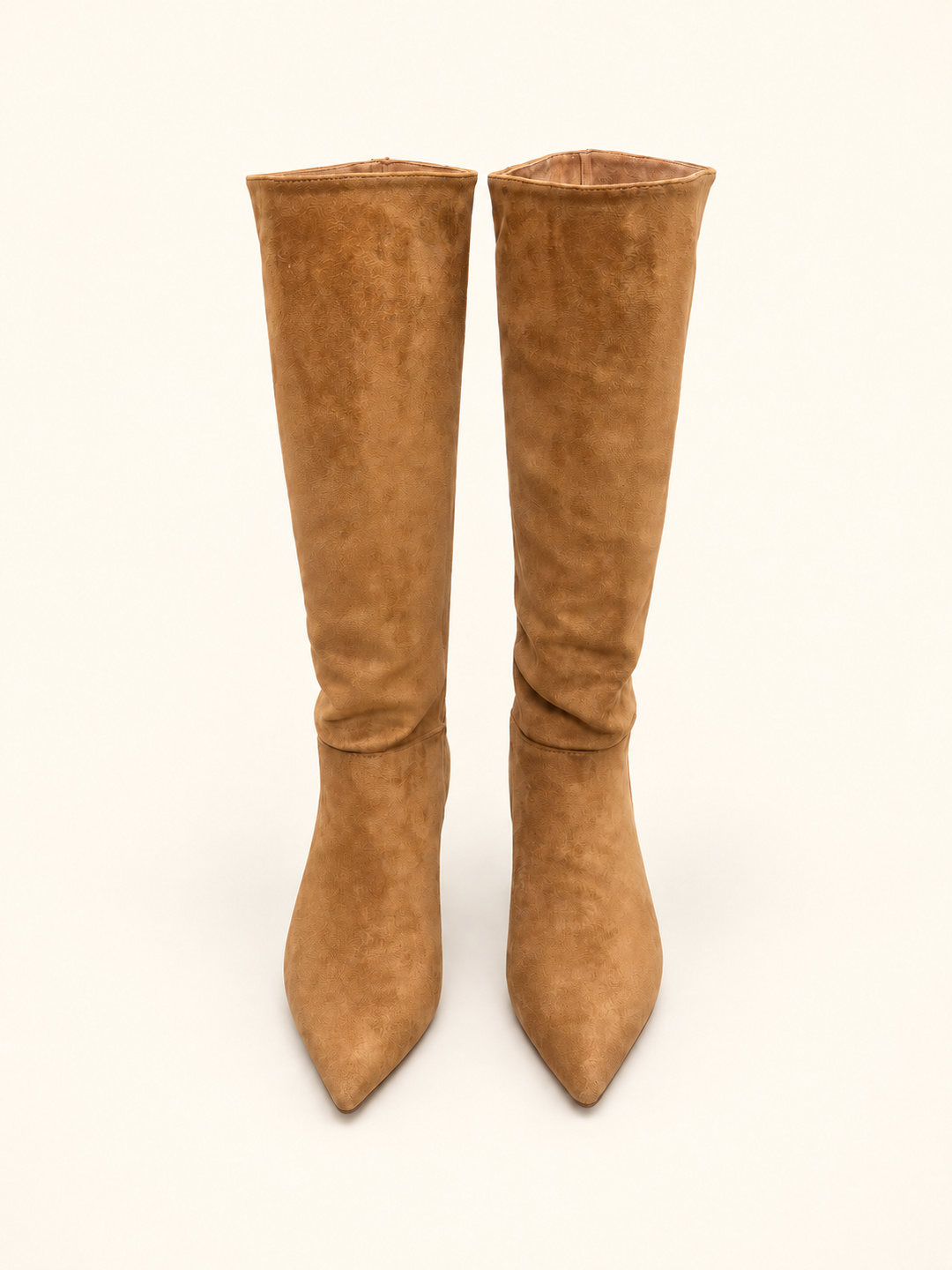 Front view of Corkys Company Party camel knee-high boots with pointed toes on a cream background.