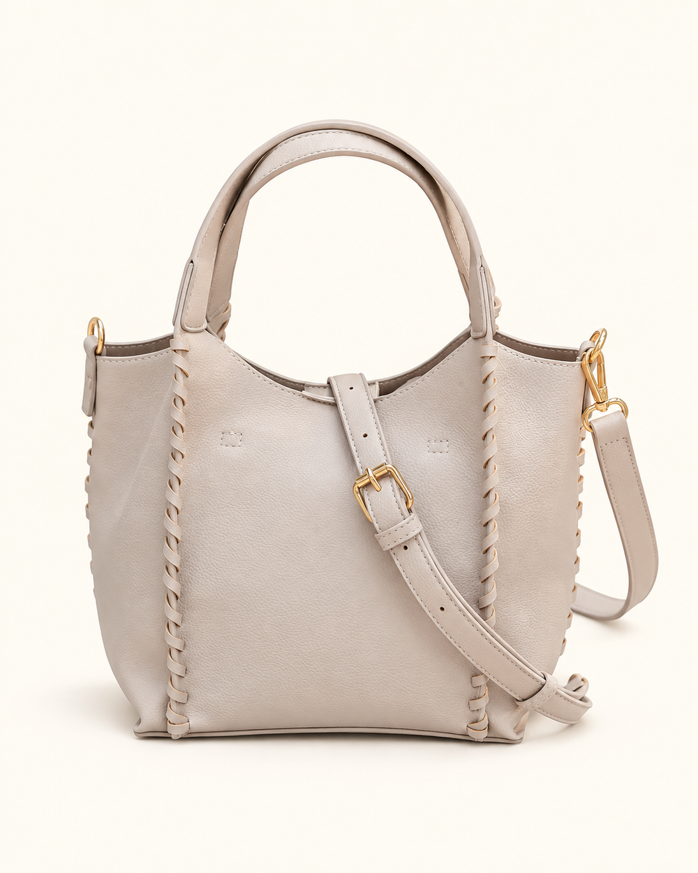 Back view of the Stone Allison Tote by Caroline Hill featuring whipstitch detailing, dual top handles, gold hardware, and an adjustable strap.