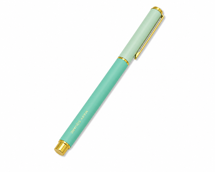 Mint and teal Snap Cap Colorblock Pen by Mary Square with gold hardware on a clean white background.