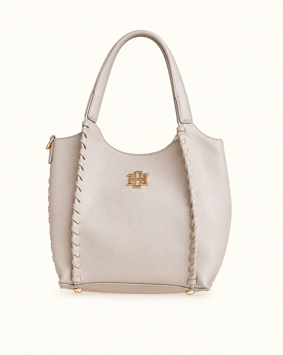 Front view of the Stone Caroline Hill Allison Tote with dual handles, whipstitch detailing, gold logo hardware, and protective base feet.
