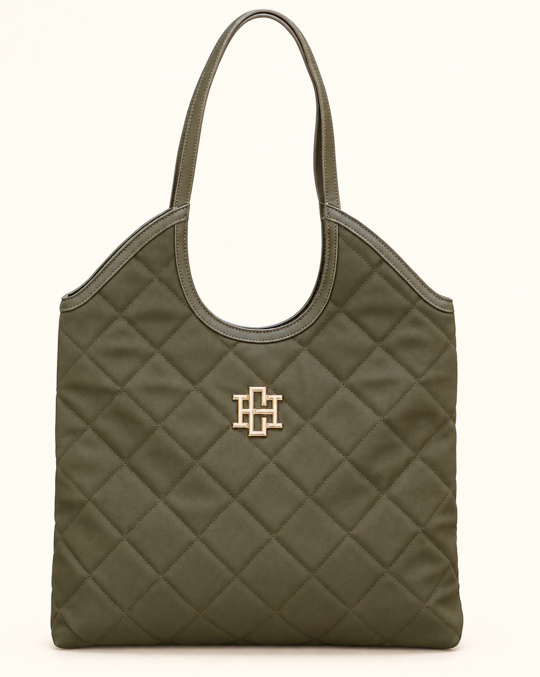 Front view of the Caroline Hill Greyson Tote in olive with diamond-quilted detailing, dual shoulder straps, and gold logo hardware on a cream background.