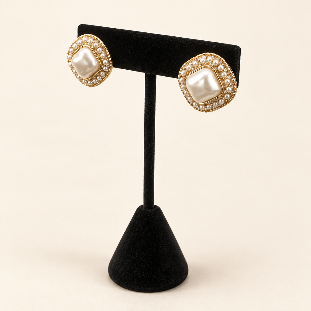Angled view of Pearl Caviar Square Earrings showing the dimensional pearl centers, petite pearl borders and gold-tone details.
