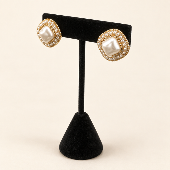 Angled view of Pearl Caviar Square Earrings showing the dimensional pearl centers, petite pearl borders and gold-tone details.