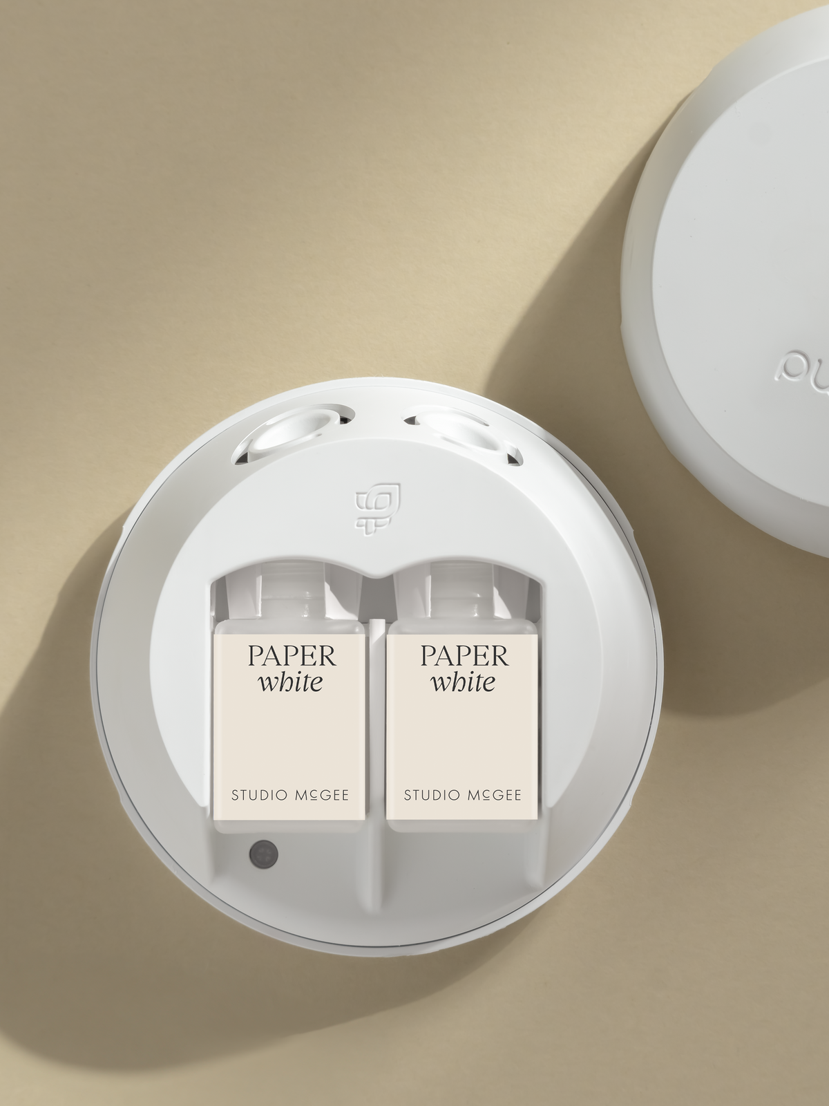 Pura smart diffuser with Studio McGee Paper White fragrance refills inserted