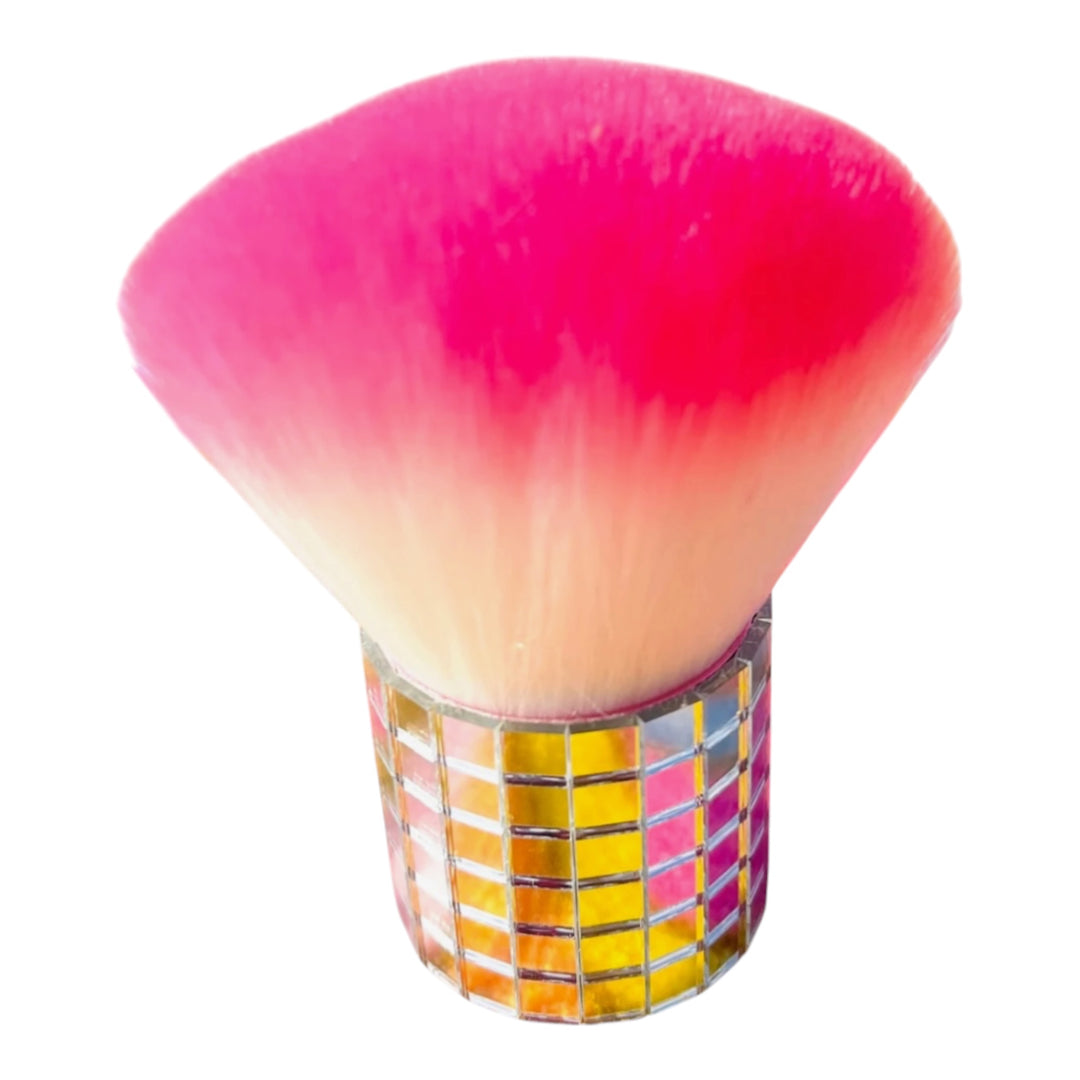 sert Bronze kabuki makeup brush with ultra-soft pink and white bristles and a mirrored mosaic handle on a white background.