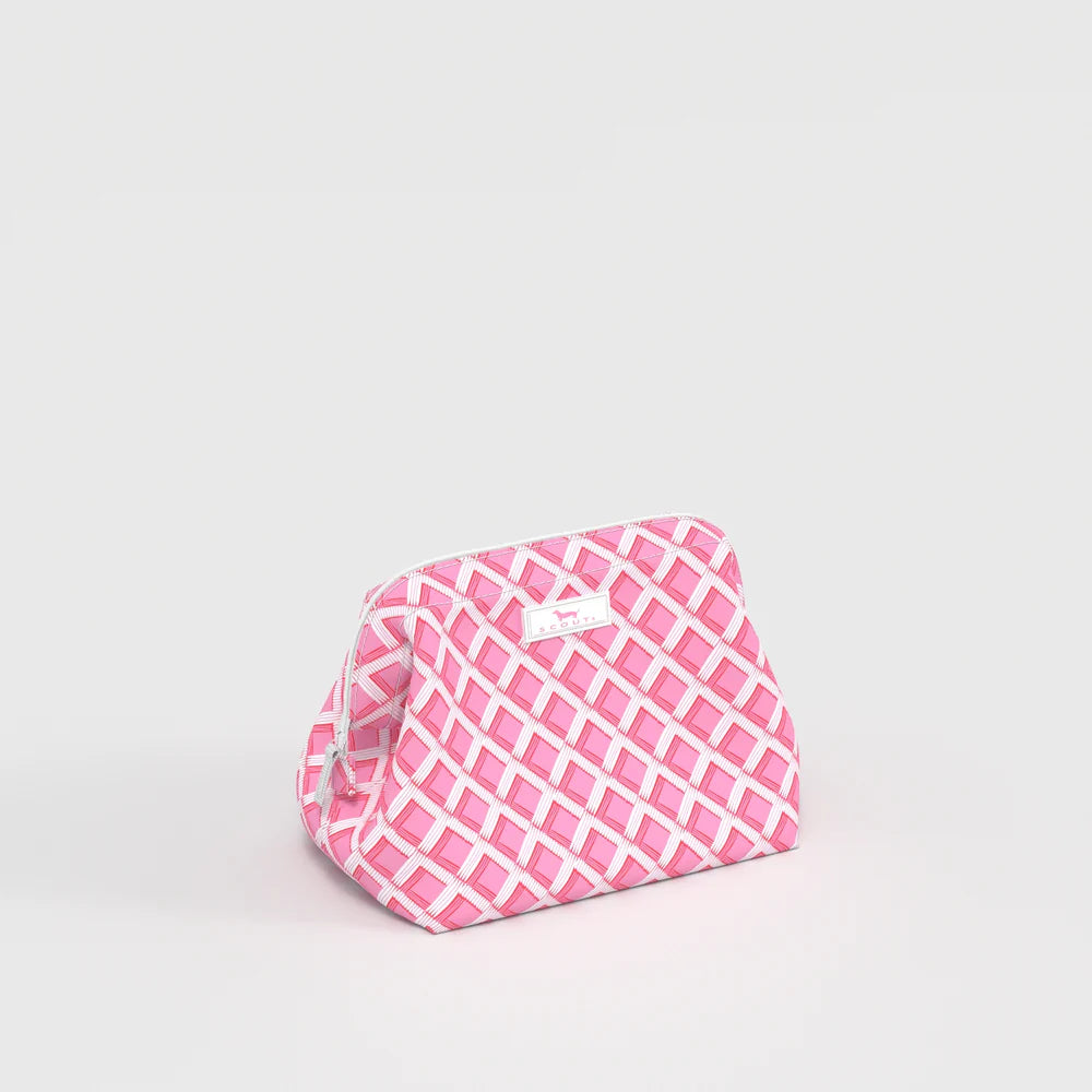 Angled side view of Little Mouth Makeup Bag in Garden Gate pink lattice pattern, structured small makeup bag with wide opening.