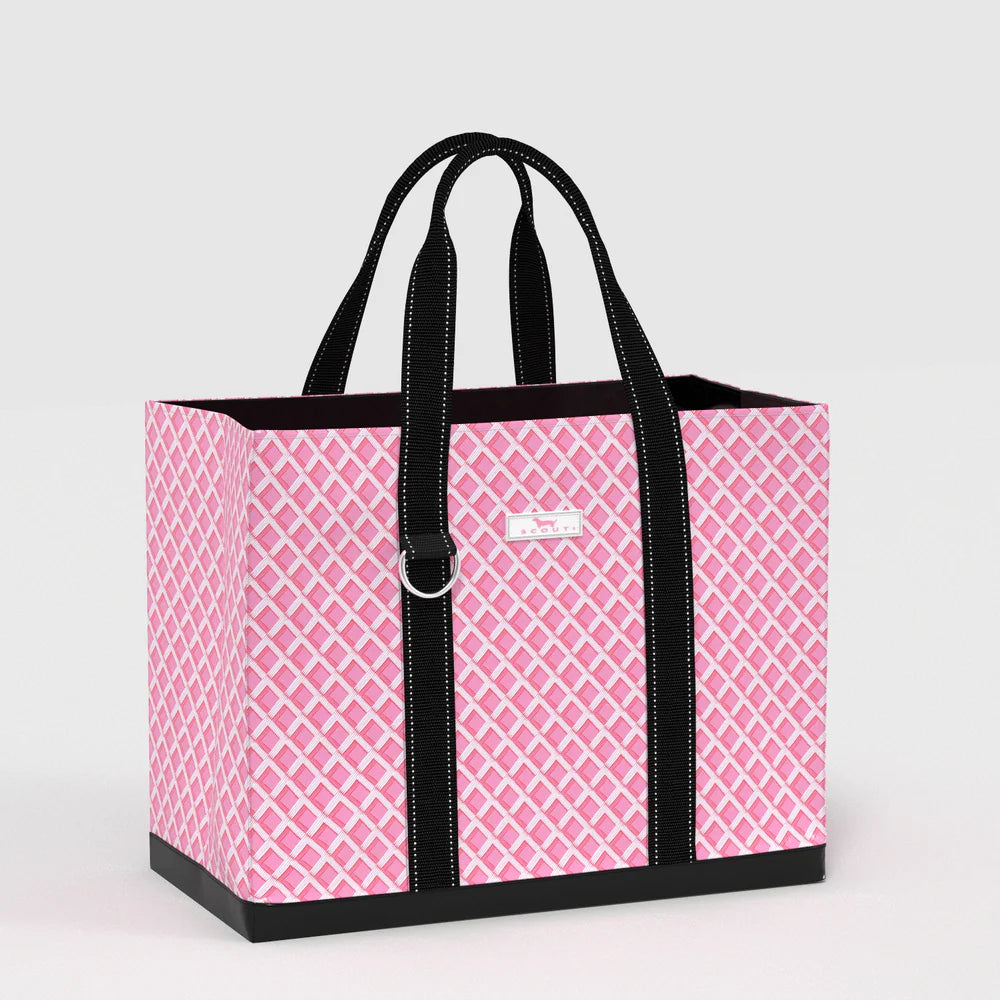 Angled view of Original Deano Tote Large Bag in Garden Gate pink lattice pattern, durable large tote with wide base and reinforced black straps.