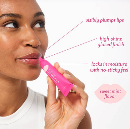 Woman holding a pink lip balm with text highlighting its features.