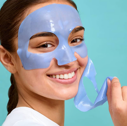 Woman wearing a blue face mask against a light blue background