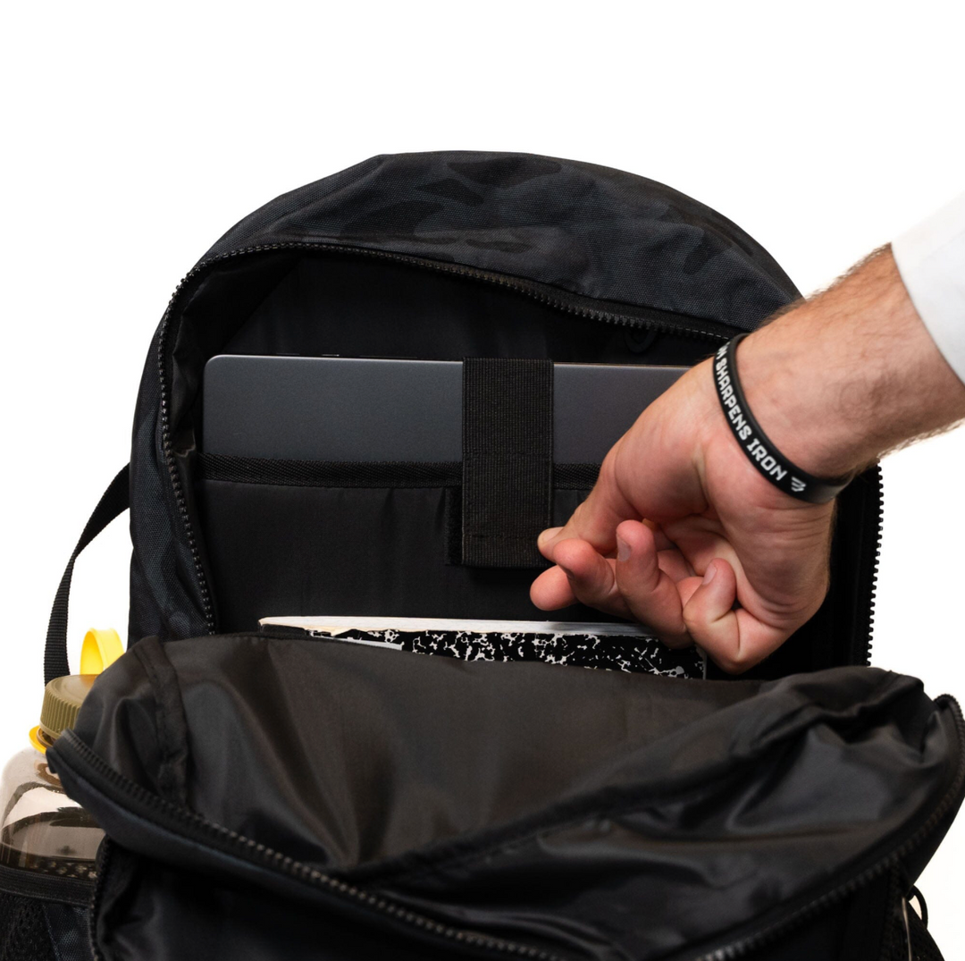 Burlebo Black Camo backpack featuring the organized interior with padded laptop sleeve and storage compartments for school, work, or travel essentials.