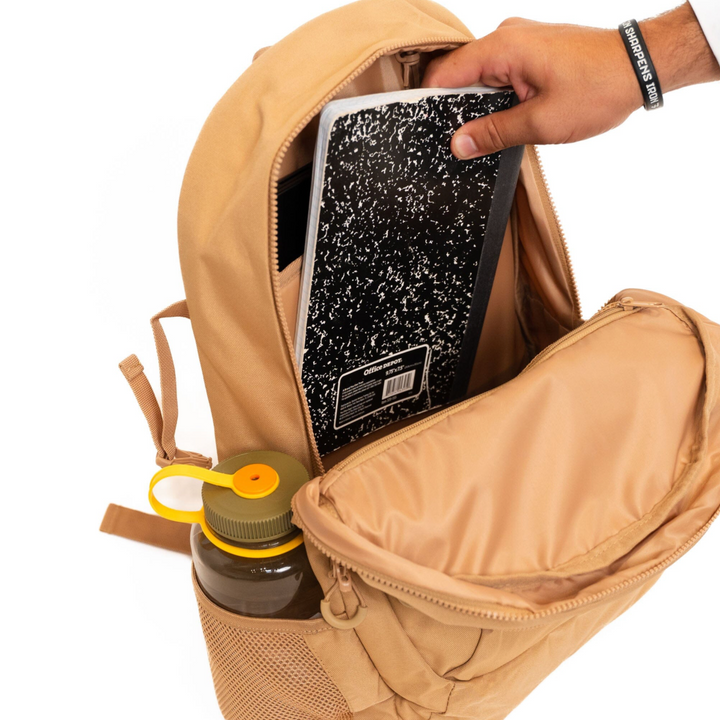Burlebo Coyote Tan backpack featuring the organized interior with a padded laptop sleeve and storage compartments for school, work, or travel essentials.