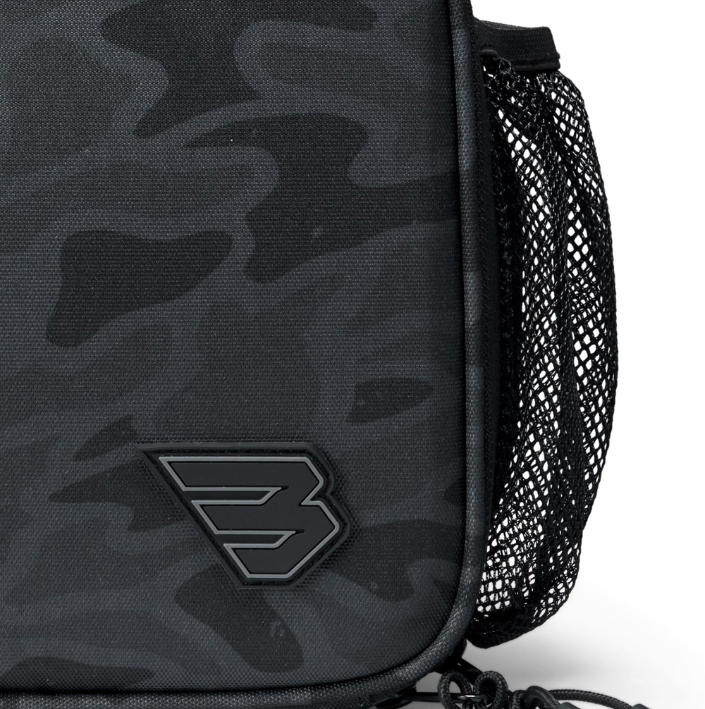 Close-up of the Burlebo Black Camo lunchbox featuring the textured camo pattern, black logo patch, and durable polyester construction.