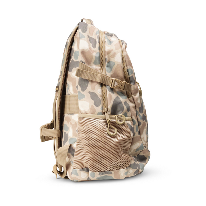 Side view of the Burlebo Pintail Camo backpack highlighting the side mesh pocket, durable polyester construction, and comfortable profile.