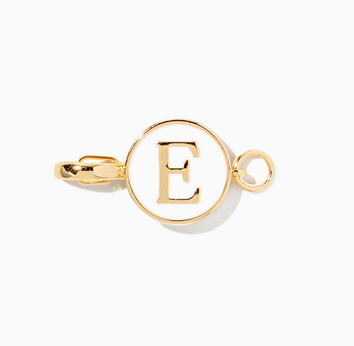 A gold initial pendant charm featuring the letter &