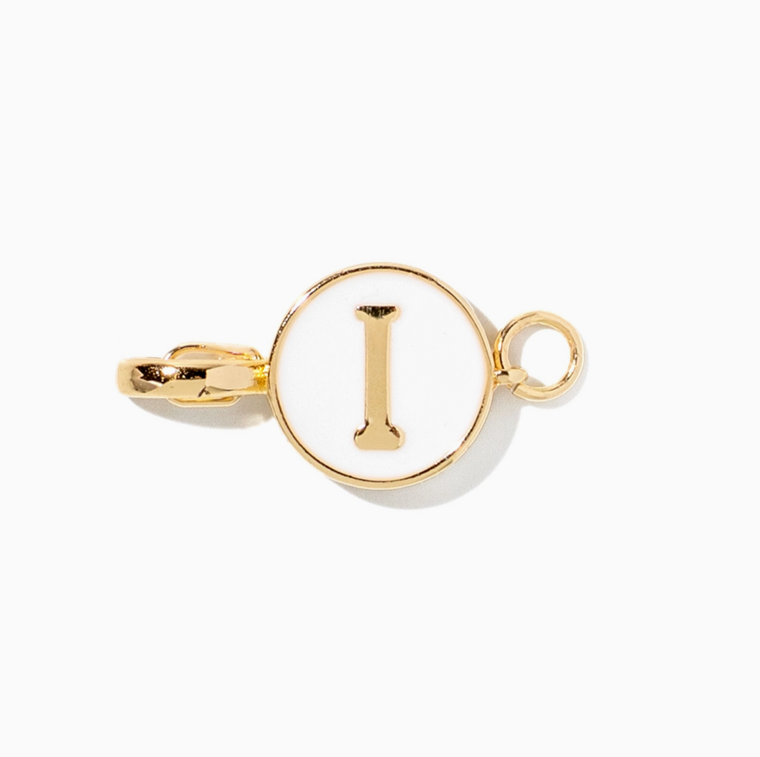 A gold initial pendant charm featuring the letter &