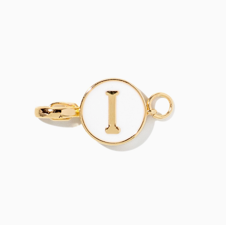 A gold initial pendant charm featuring the letter &