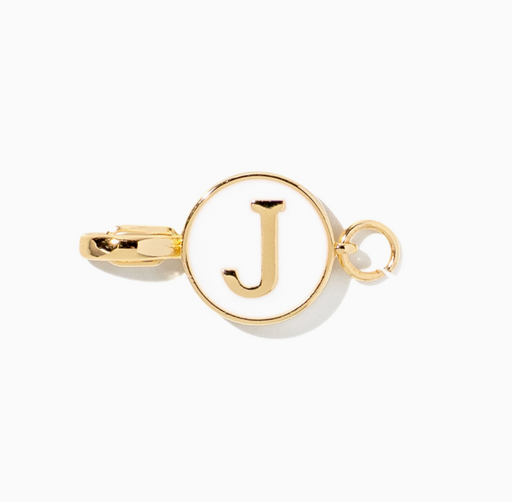 A gold-toned initial pendant charm featuring the letter &