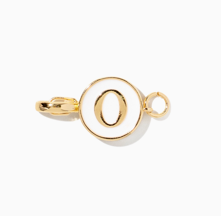 A gold initial charm spelling &