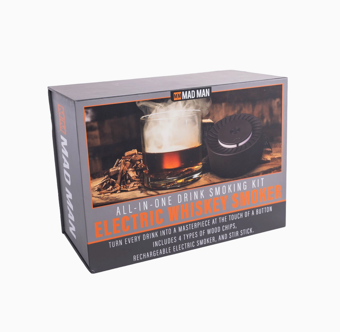 A boxed drink smoking kit labeled MAD MAN Electric Whiskey Smoker, shown at a slight angle on a plain white background. The box is dark gray with orange and white text and a printed photo of whiskey, wood chips, and a smoking device.