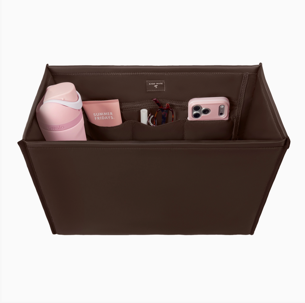 Case-Mate brown tote organizer insert with zippered compartment and multiple interior pockets holding a water bottle, cosmetics, sunglasses, and smartphone
