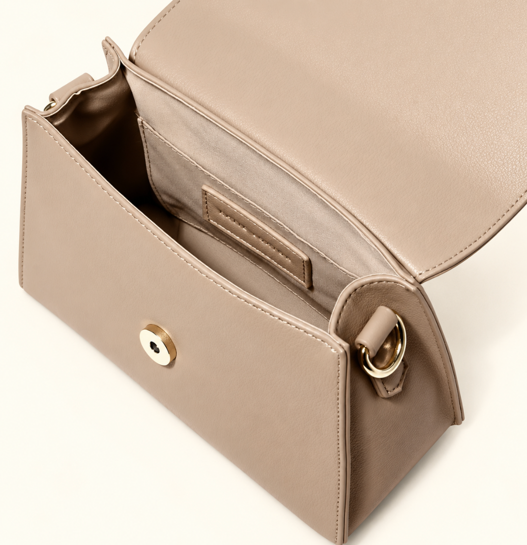 Open Katie Loxton Rae Crossbody Bag in Soft Tan showing the lined interior, slip pocket, magnetic closure, and gold-tone hardware.