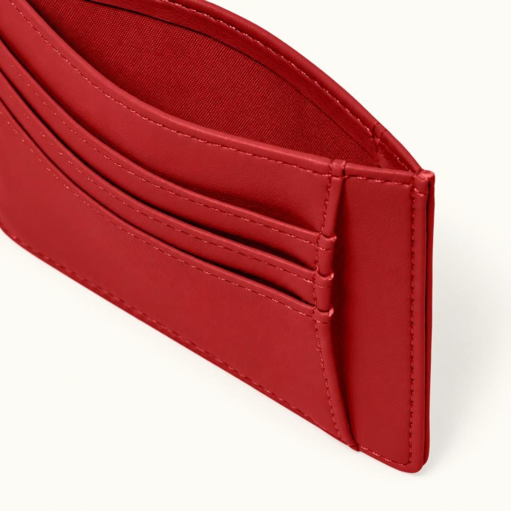 Close-up of Katie Loxton Lily Cardholder in Garnet Red showing layered card slots, additional pocket compartment, and tonal stitching.