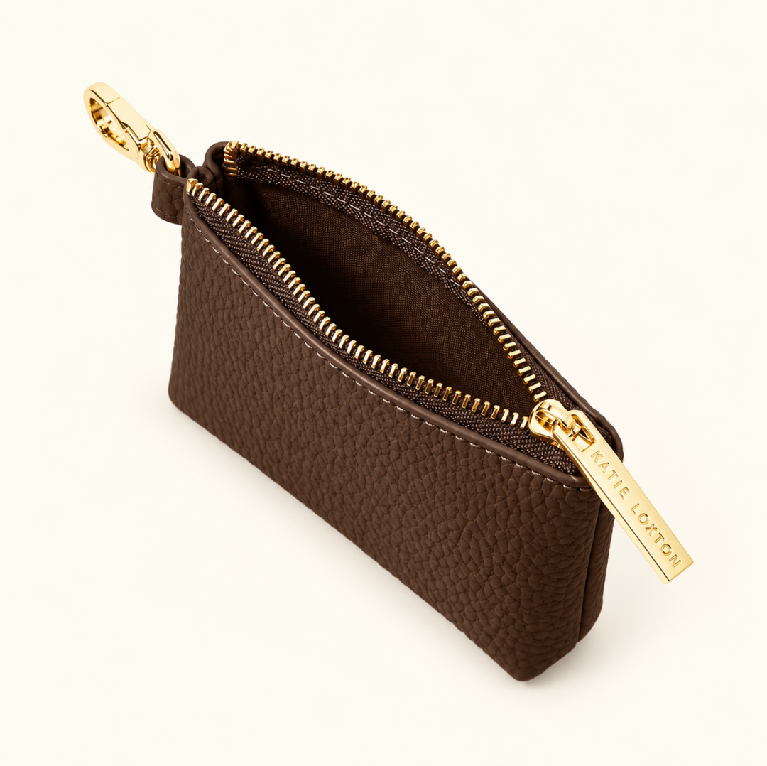 Open Katie Loxton Evie Clip-On Coin Purse in Chocolate showing the compact interior, pebbled vegan leather and gold-tone zipper and clip.