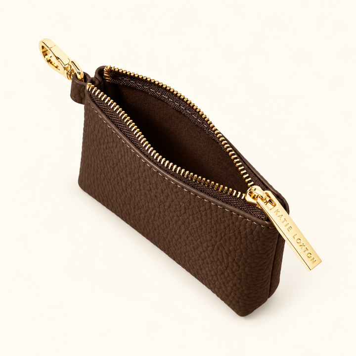 Open Katie Loxton Evie Clip-On Coin Purse in Chocolate showing the compact interior, pebbled vegan leather and gold-tone zipper and clip.