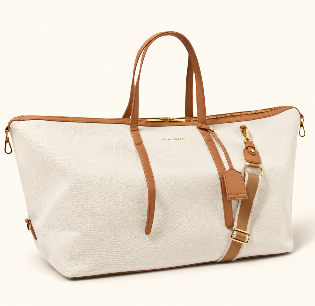 Katie Loxton Capri Canvas Weekender Bag in tan and off white with vegan leather trim, gold hardware, top handles and shoulder strap