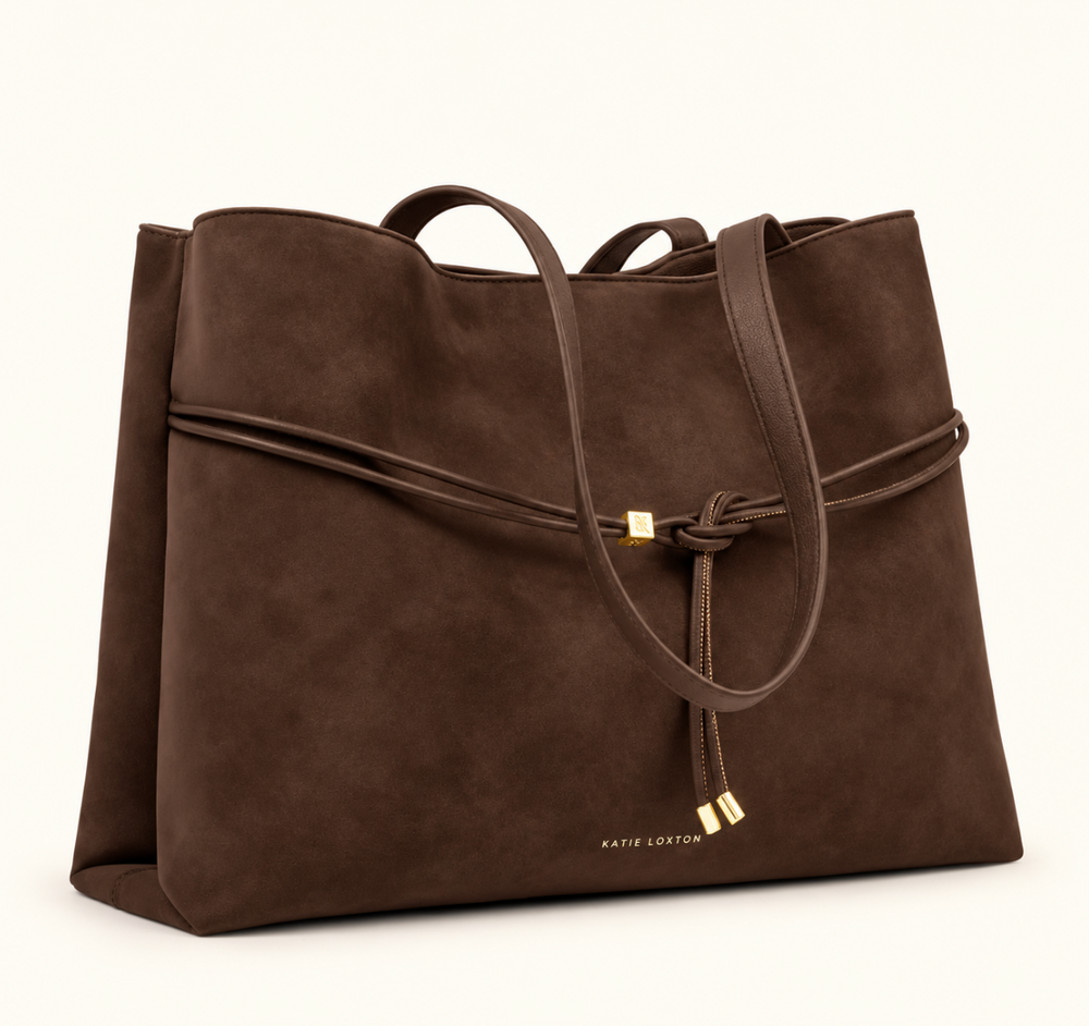 Angled view of Katie Loxton Lori Tote Bag in Bitter Chocolate suedette with spacious silhouette, shoulder straps and gold-tone accents