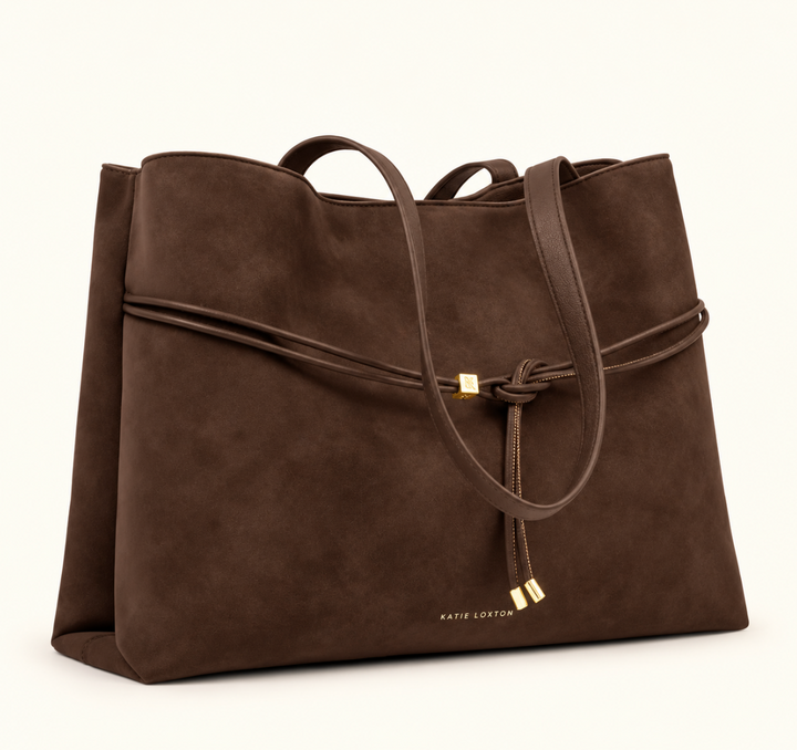 Angled view of Katie Loxton Lori Tote Bag in Bitter Chocolate suedette with spacious silhouette, shoulder straps and gold-tone accents